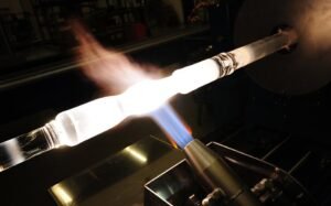 High temperature flame processing of quartz glass tubes